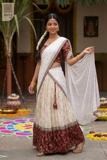 Front full standing shot of a half saree as a beautiful maroon border lehenga saree for weddings.