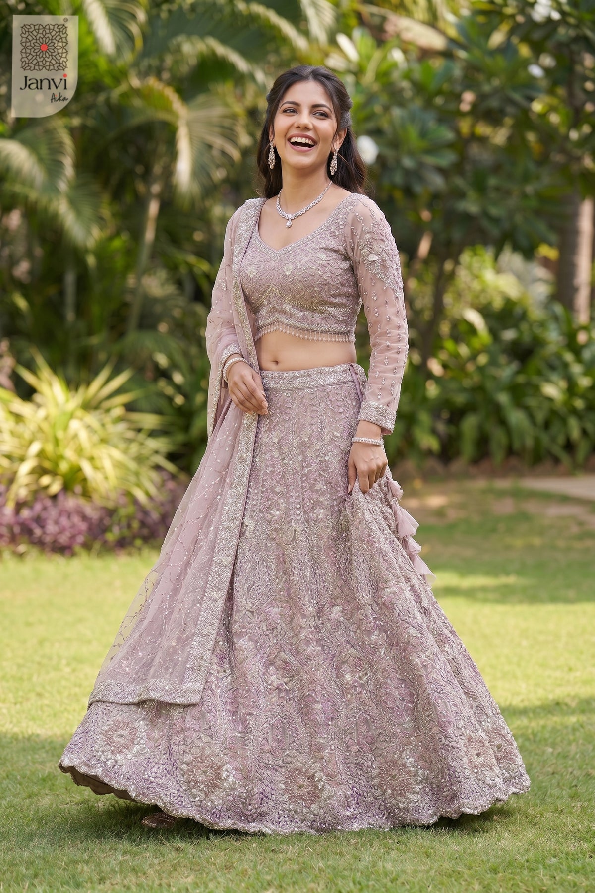 Standing side profile shot of a classic rose gold/dusty lilac net lehenga for women online design.