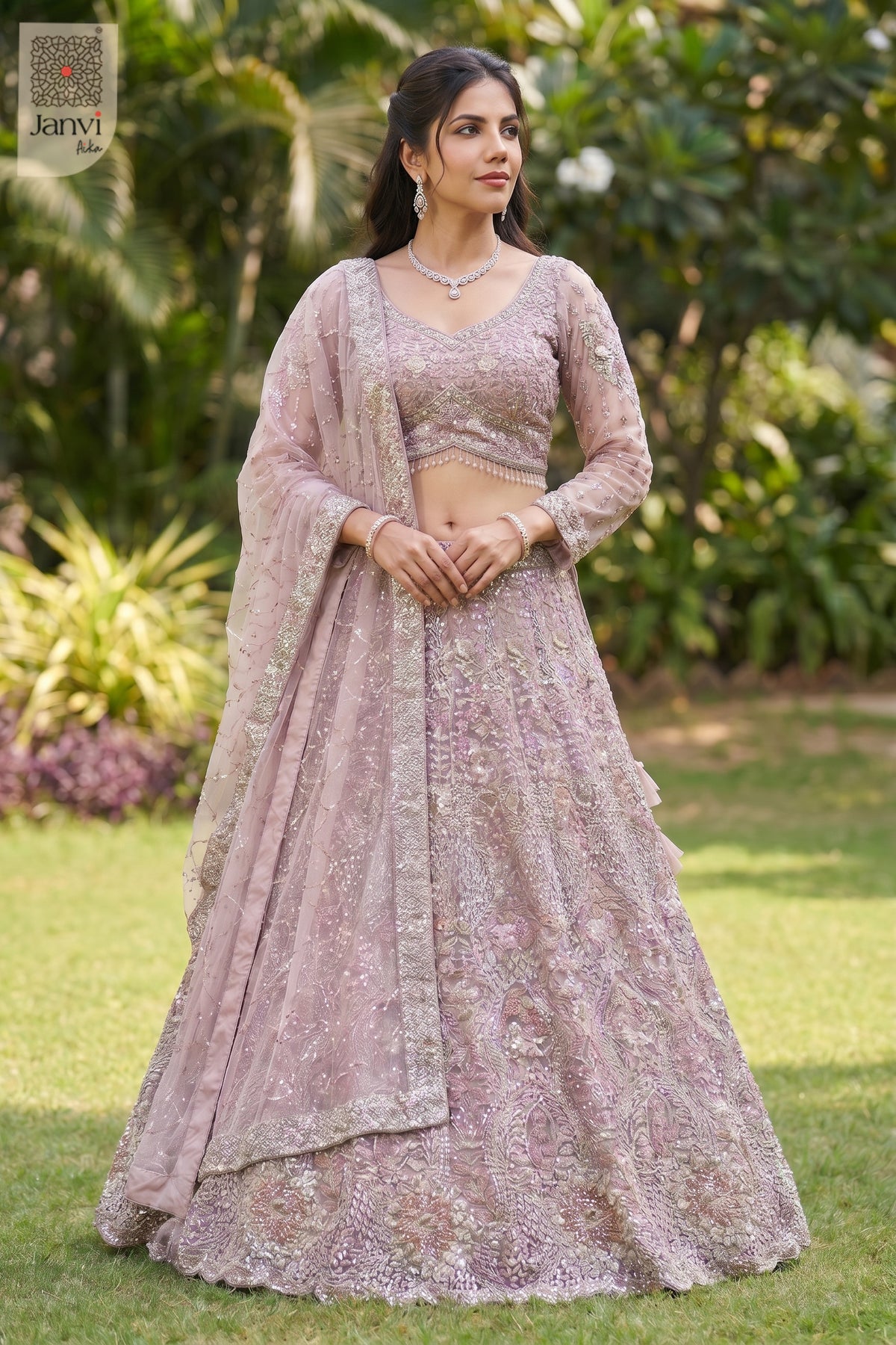Front full standing shot of a classic rose gold/dusty lilac net lehenga ki design design.