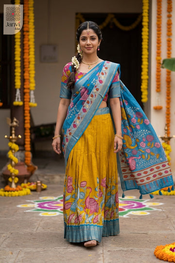 Front full standing shot of a half saree as a beautiful lehenga saree yellow for weddings.