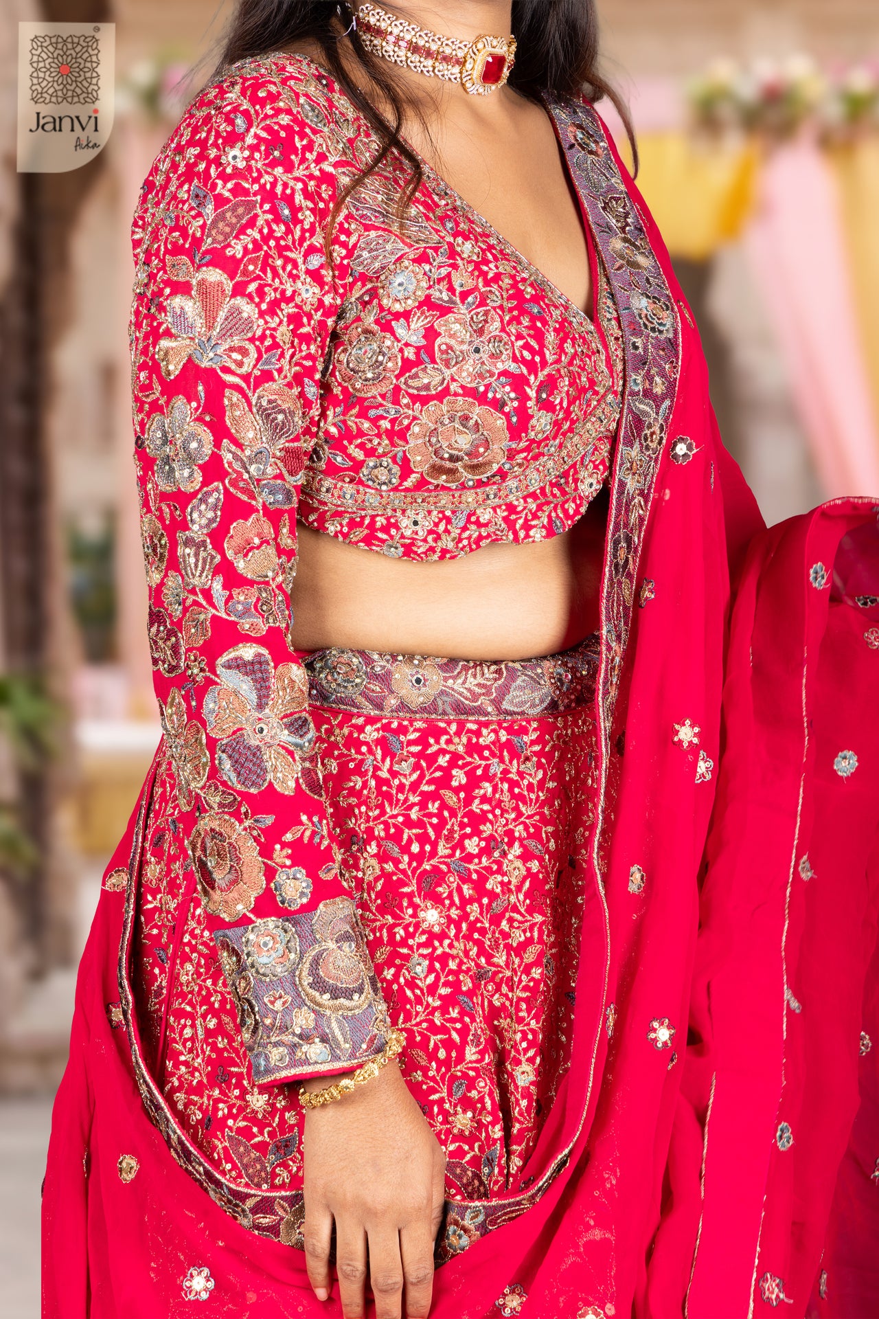 Stunning dark pink georgette half saree like lehenga with an exquisite sleeve border close up view.