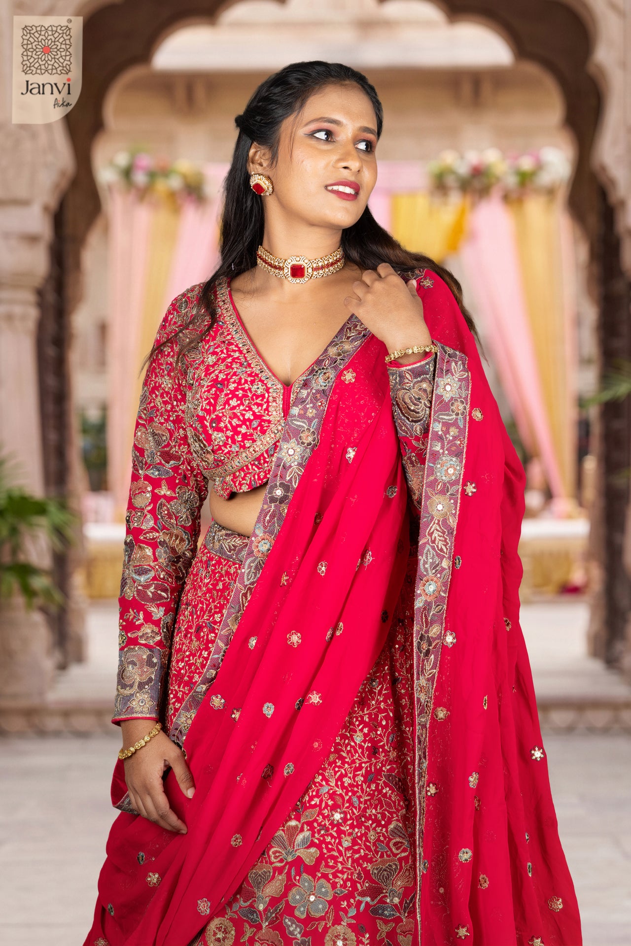 Elegant dark pink georgette pastel bridal lehenga featuring a detailed waist up front smiling view.