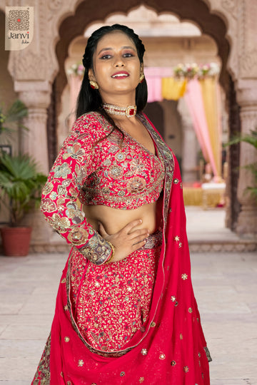 Standing side profile shot of a classic dark pink georgette lehenga for women party design.