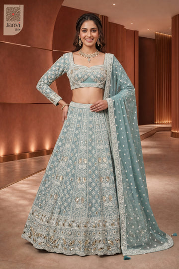 This front full standing shot showcases a gorgeous seafoam green georgette green color lehenga.