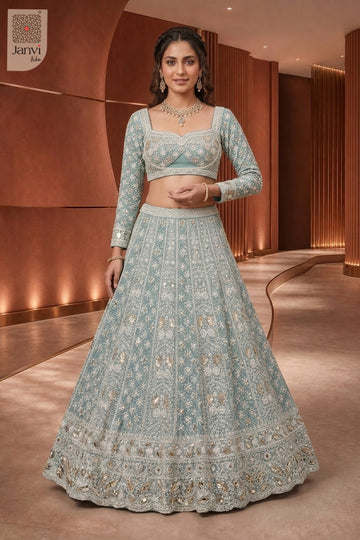 Front full standing shot of a classic seafoam green georgette heavy designer lehenga design.