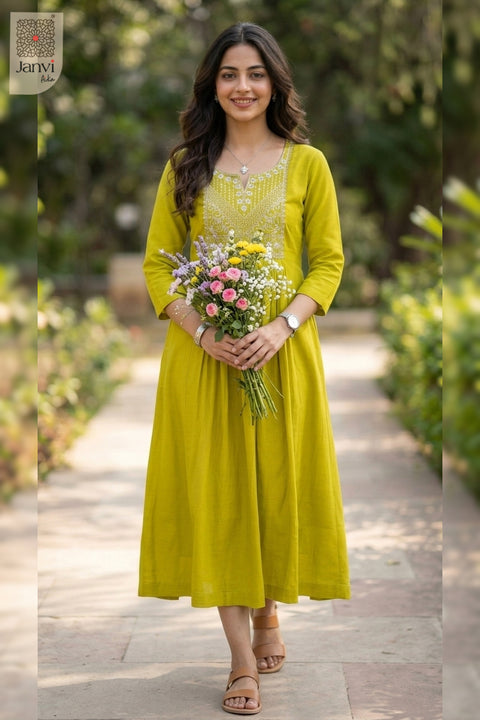 Holding flower bouquet in moderate yellowish green dress tops for women in park setting