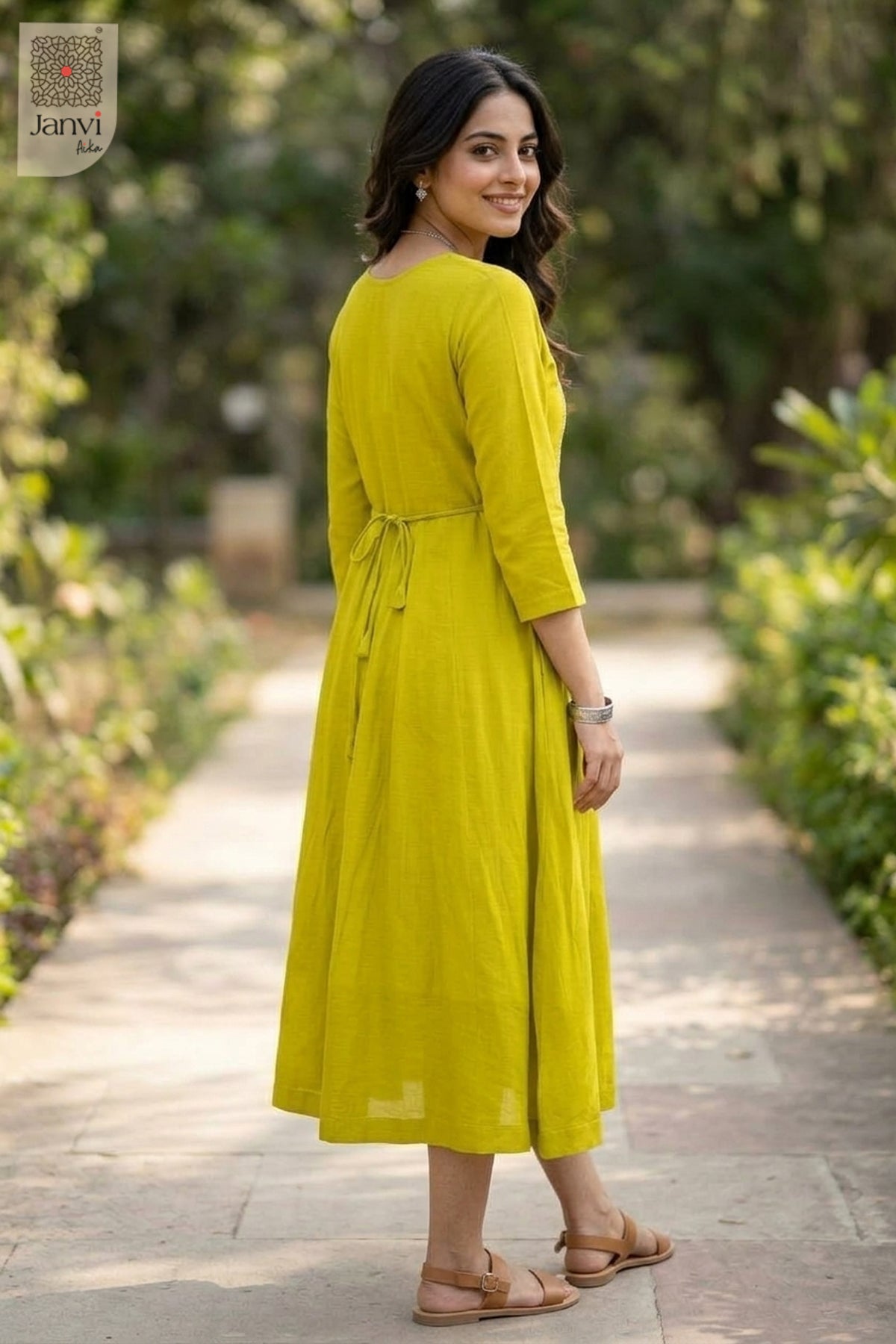 Over the shoulder rear view in moderate yellowish green long tunic tops for women cut