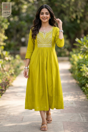 Posing in moderate yellowish green unique tops for women while touching hair in park