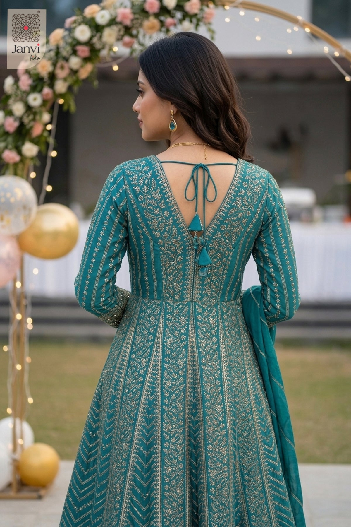 Admire the exquisite tassel tie details in a back close up of this majestic gaun party wear.