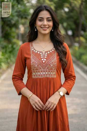 Front portrait of smiling woman wearing rust beautiful tops for women in sunny park