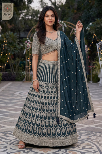 This front full standing shot showcases a gorgeous bottle green georgette green color lehenga.
