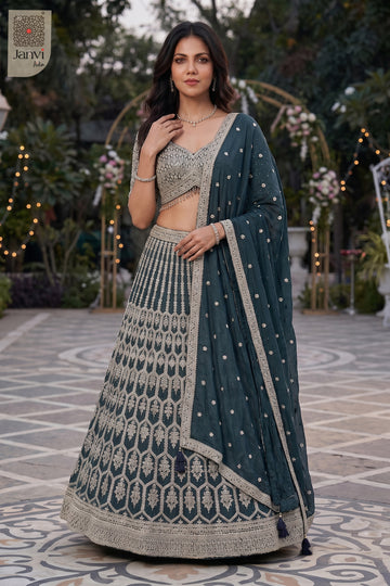 Stunning bottle green georgette lehenga with an exquisite front full standing shot.
