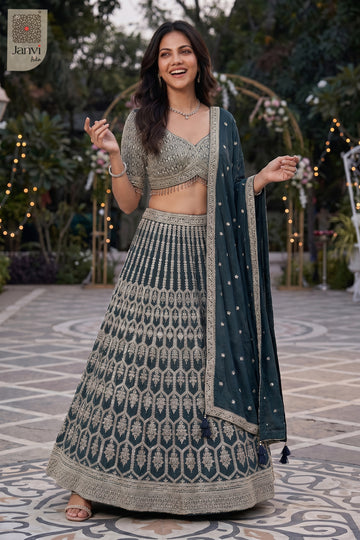 Front full standing shot of a classic bottle green georgette lehenga choli for wedding design.
