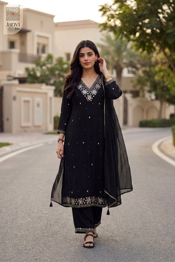 Outdoor walking view in an elegant black festive georgette anarkali kurti attire.