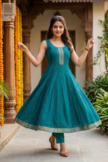 Full twirl motion showing the wide flare of a ramar green anarkali kurta attire.