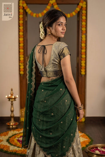 Back view looking over shoulder in champagne silk lehenga as half saree styling.