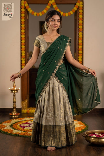 Full sequence standing pose in champagne silver party lehenga saree with green drape.