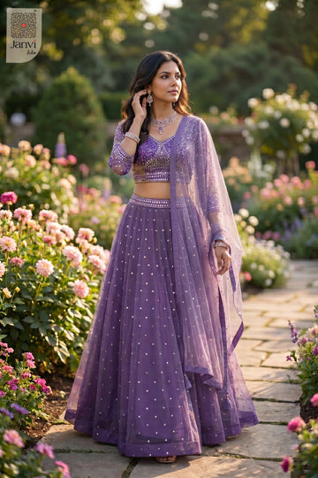 An exquisite gota work lehenga with standing side profile shot in a premium purple net design.
