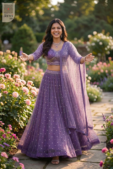 Front full standing shot of a beautiful purple net dupatta style on lehenga for weddings.