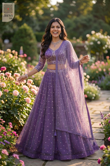 Elegant purple net purple designer lehenga featuring a detailed front full standing shot.