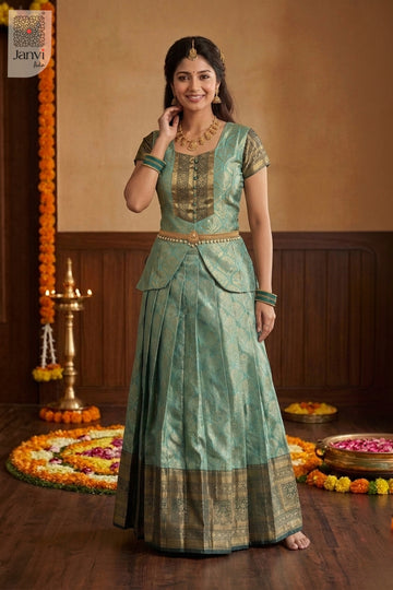 Full length jade green party wear lehenga saree with traditional gold waist belt.