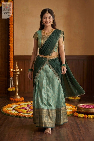 Full view of jade and emerald embroidered lehenga saree with ornate gold zari.