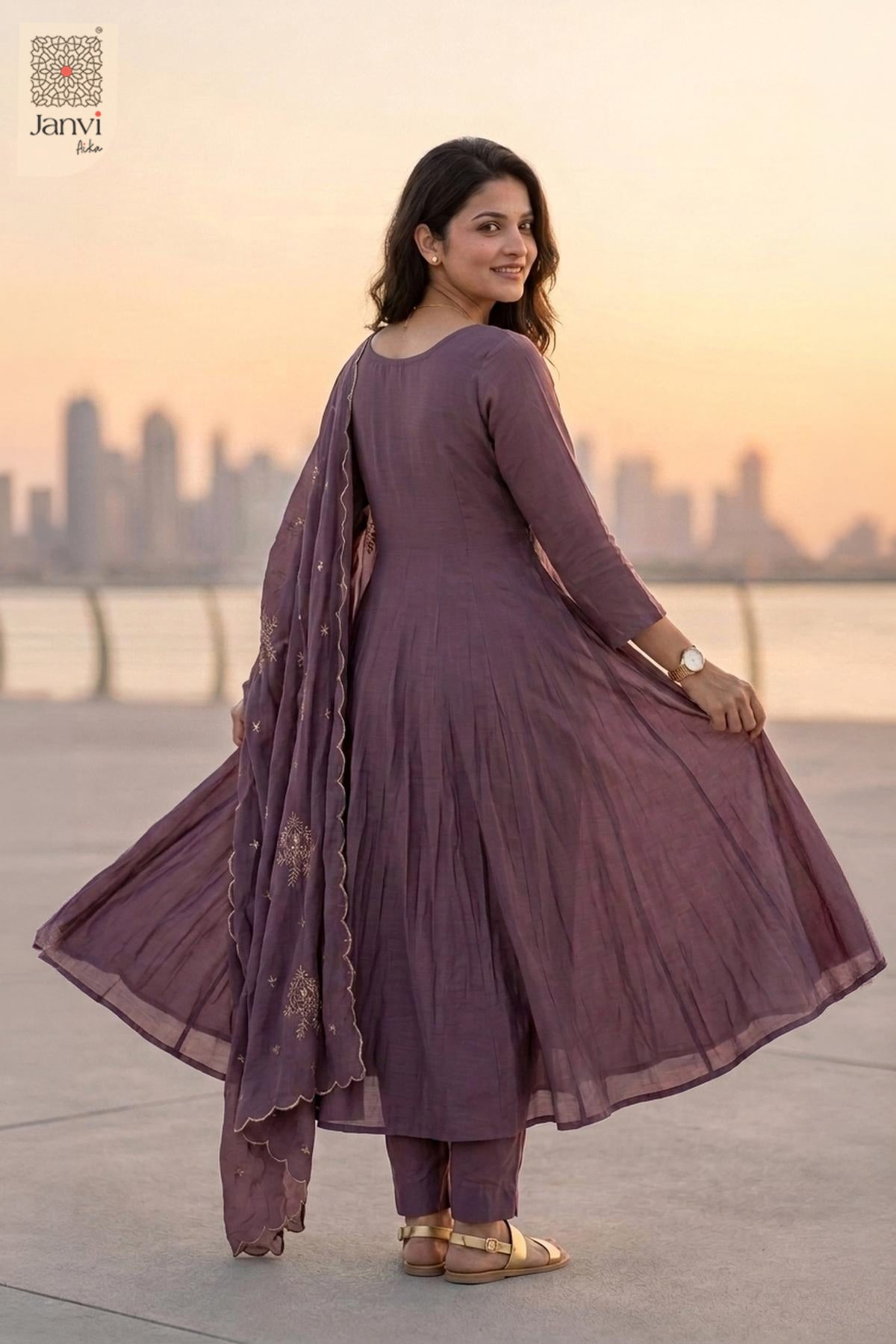 Back view of a dark lavender flared anarkali kurta with draped silk dupatta.
