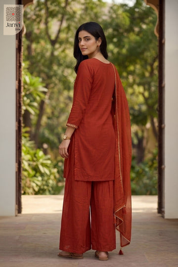 Rear back view of an orange festive embroidered anarkali kurta with sheer dupatta.