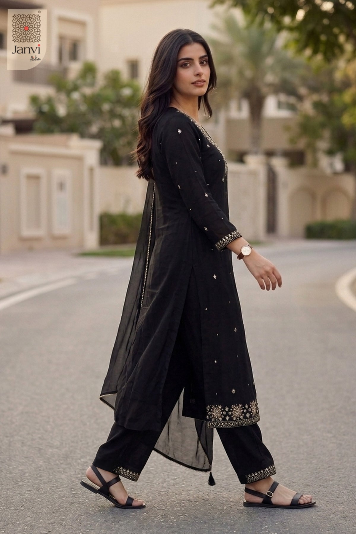 Regenerated sequence shot of a black long anarkali dress with dupatta and borders.