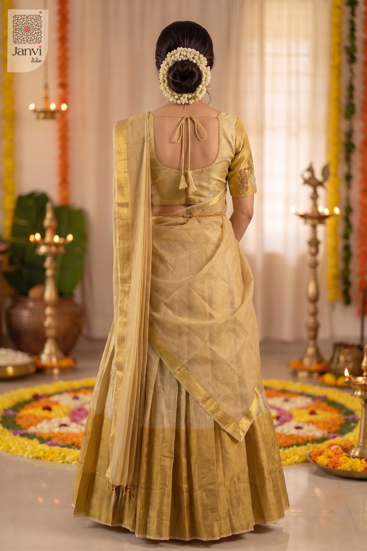 Rear view of gold tissue lehenga paired with sheer gold half saree dupatta drape.